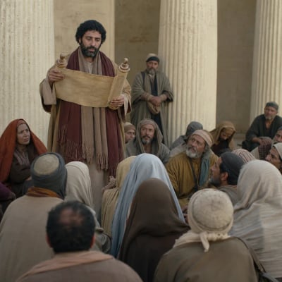 Baruch reading Jeremiah’s scroll aloud in the temple before a tired and attentive crowd during a fast.